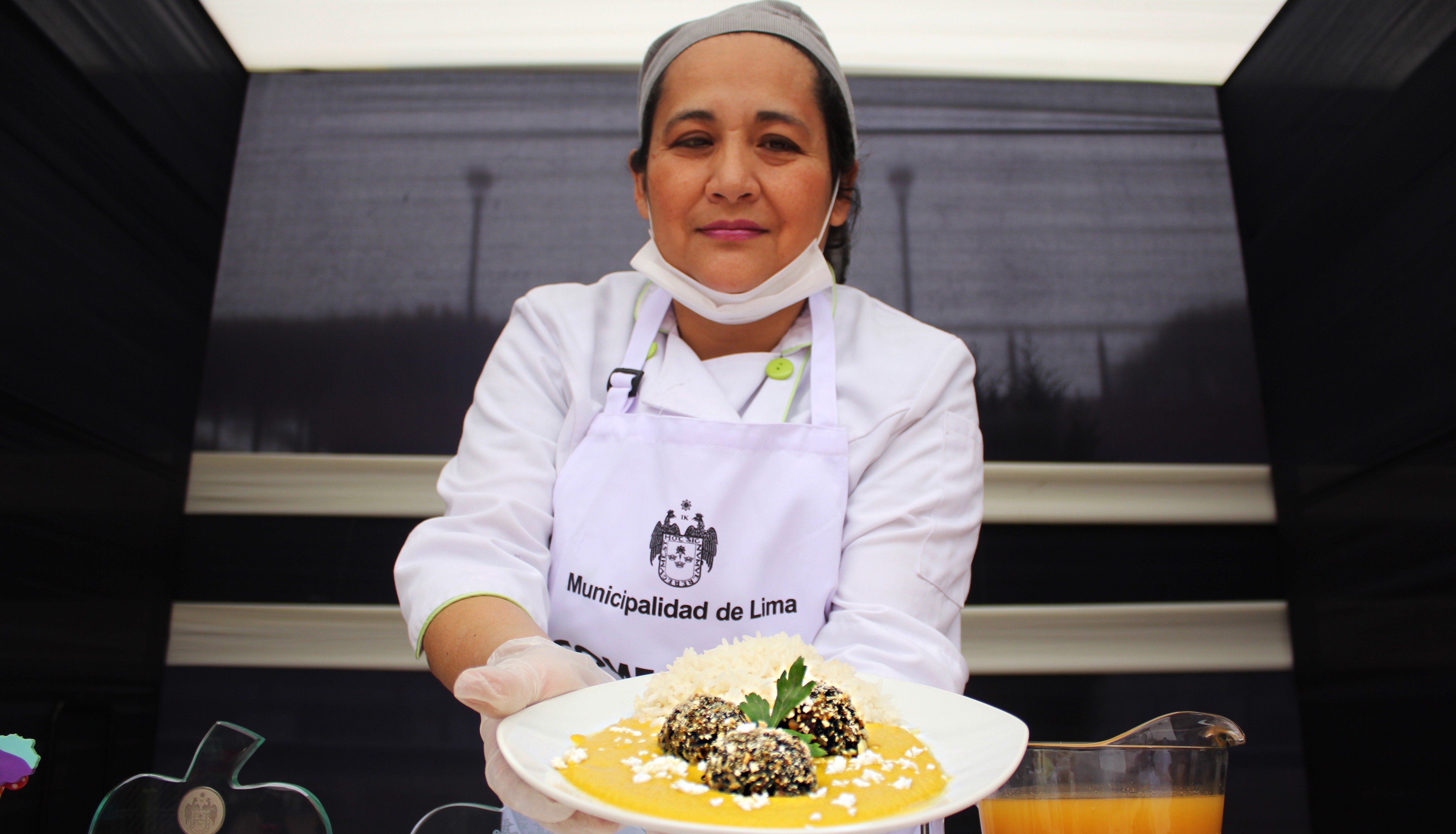 A chef presents a plate of food