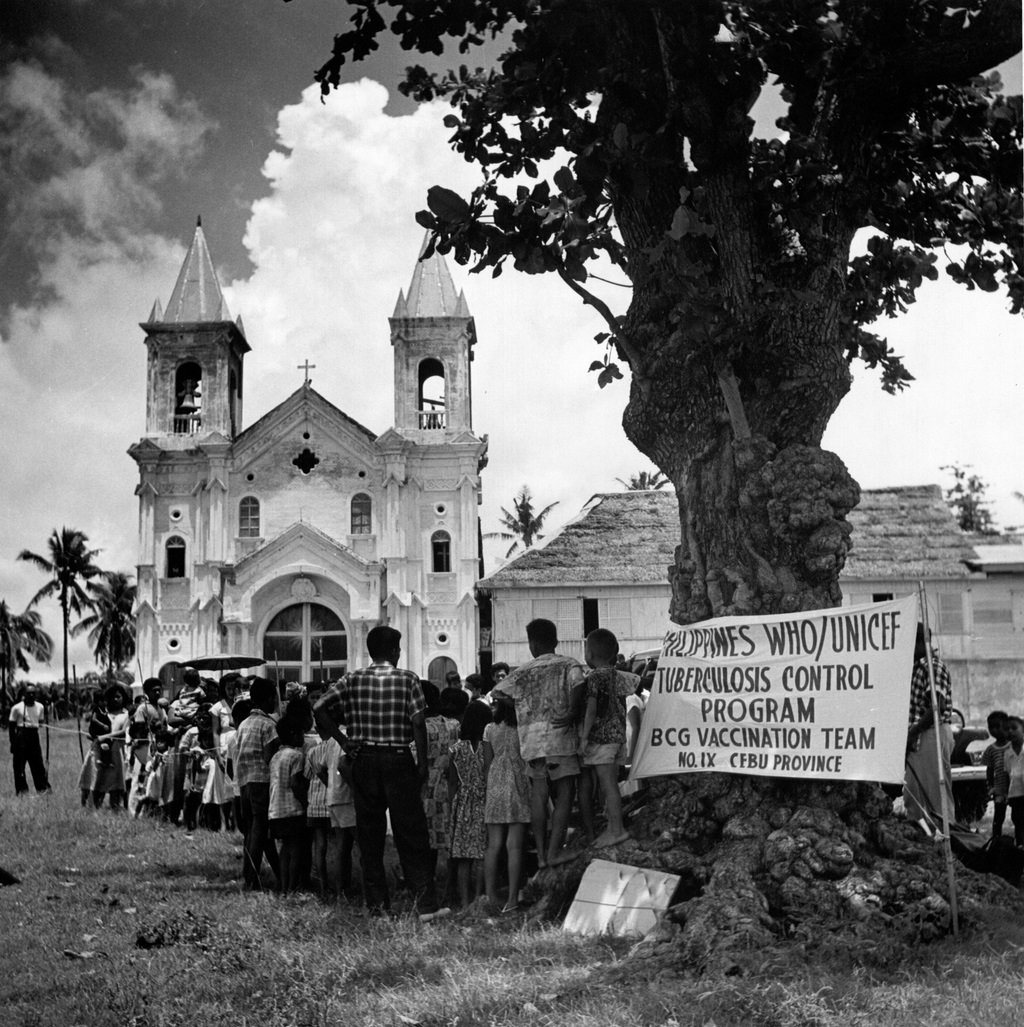 People wait for their bacille Calmette-Guérin (BCG) test in Minglanilla Municipal Square, Cebu province as part of the nationwide anti-tuberculosis campaign that started in 1951.